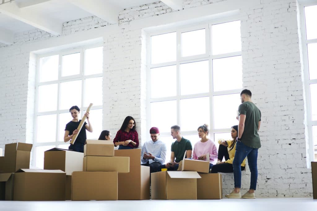office workers packing up equipment